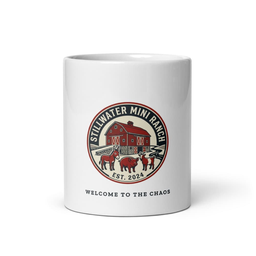 Ceramic 11oz mug printed with the Stillwater Mini Ranch barn badge and the words Welcome to the Chaos.