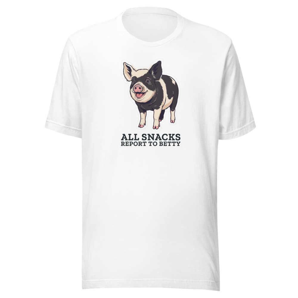 Light-colored t-shirt printed with cartoon Betty the pig and the words all snacks report to Betty. Shown in White.