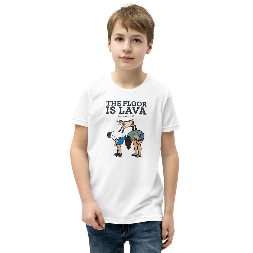 Kids t-shirt printed with Cannoli the goat leaping across two people's backs under the words The Floor Is Lava. Shown in White.