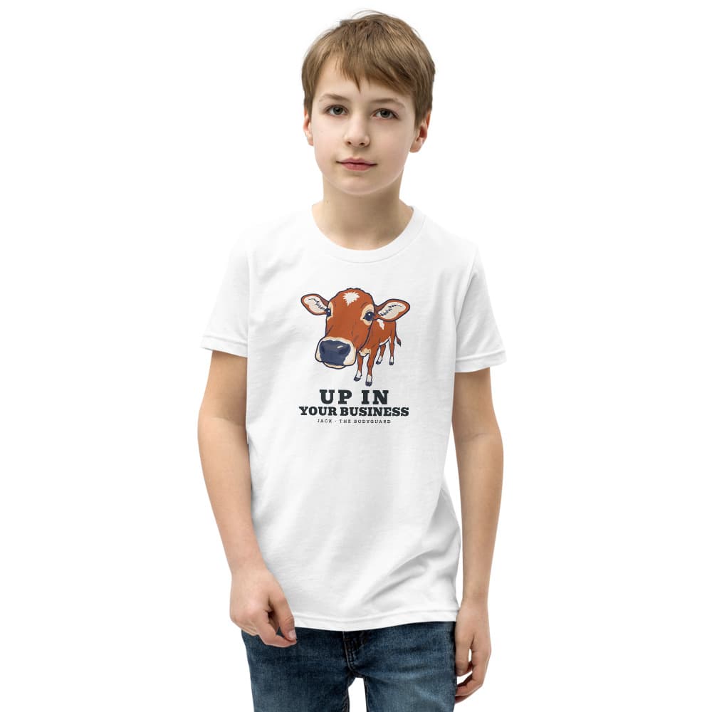 Kids t-shirt with a close-up cartoon of a mini zebu calf pushing its nose toward the viewer and the words Up in Your Business. Shown in White.